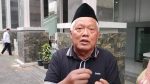 Penanganan tersangka Yai Mim oleh polisi di Malang